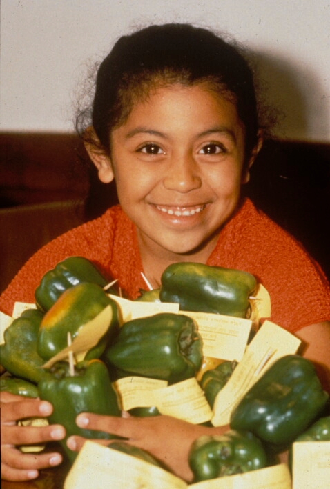 Girl with bell peppers