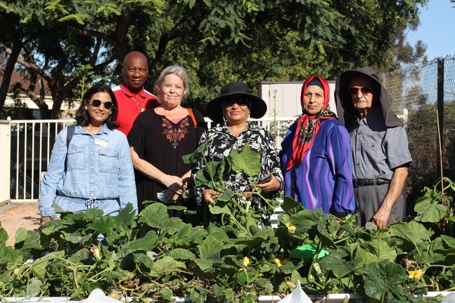 Group of people standing in a garden