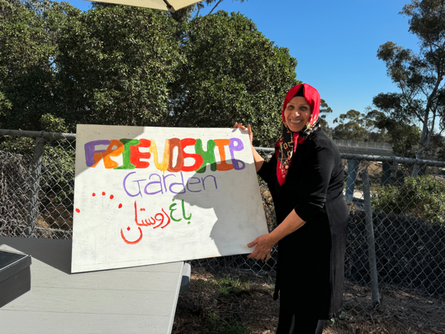 Woman holding a sign