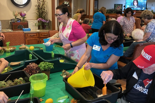 San Diego sensory group activity, handing out plants and supplies