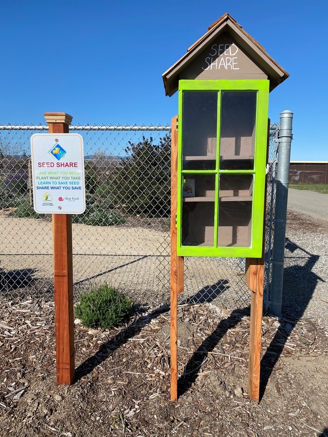 Seed share station at Martial Cottle Park, by Hillie Sato