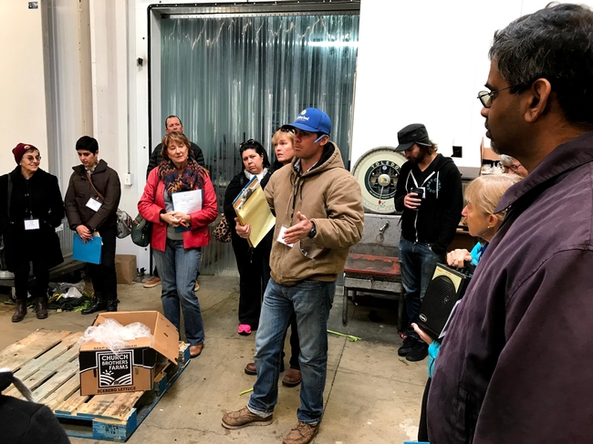 Local farmers hear from a distributor about how to get into the wholesale market during a UCCE Tour to Meet Buyers in December