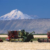 View of the Intermountain REC harvesting equipment, mountains in the background
