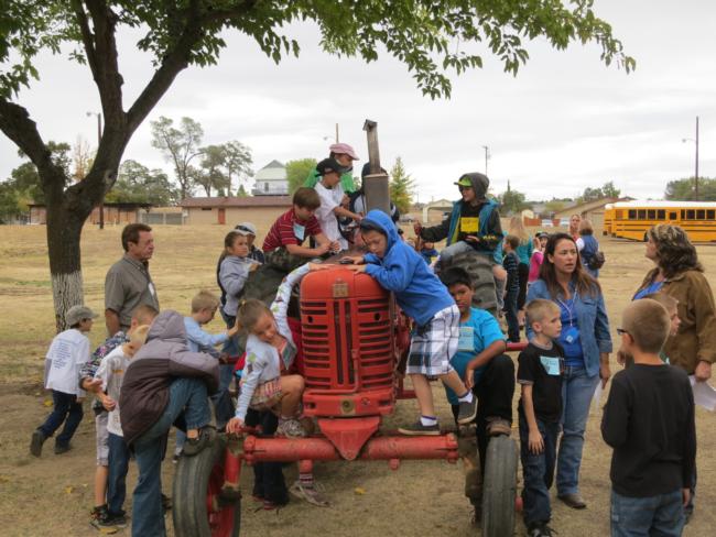 Youths Playing on Tractor Waiting to Start