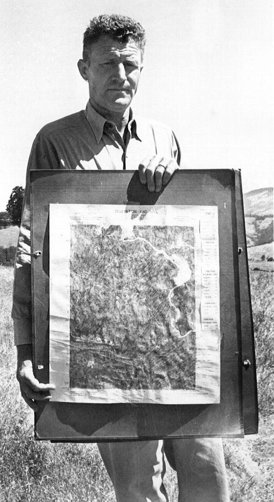 Forestry Advisor Robert Krohn with vegetation map, c. 1965
