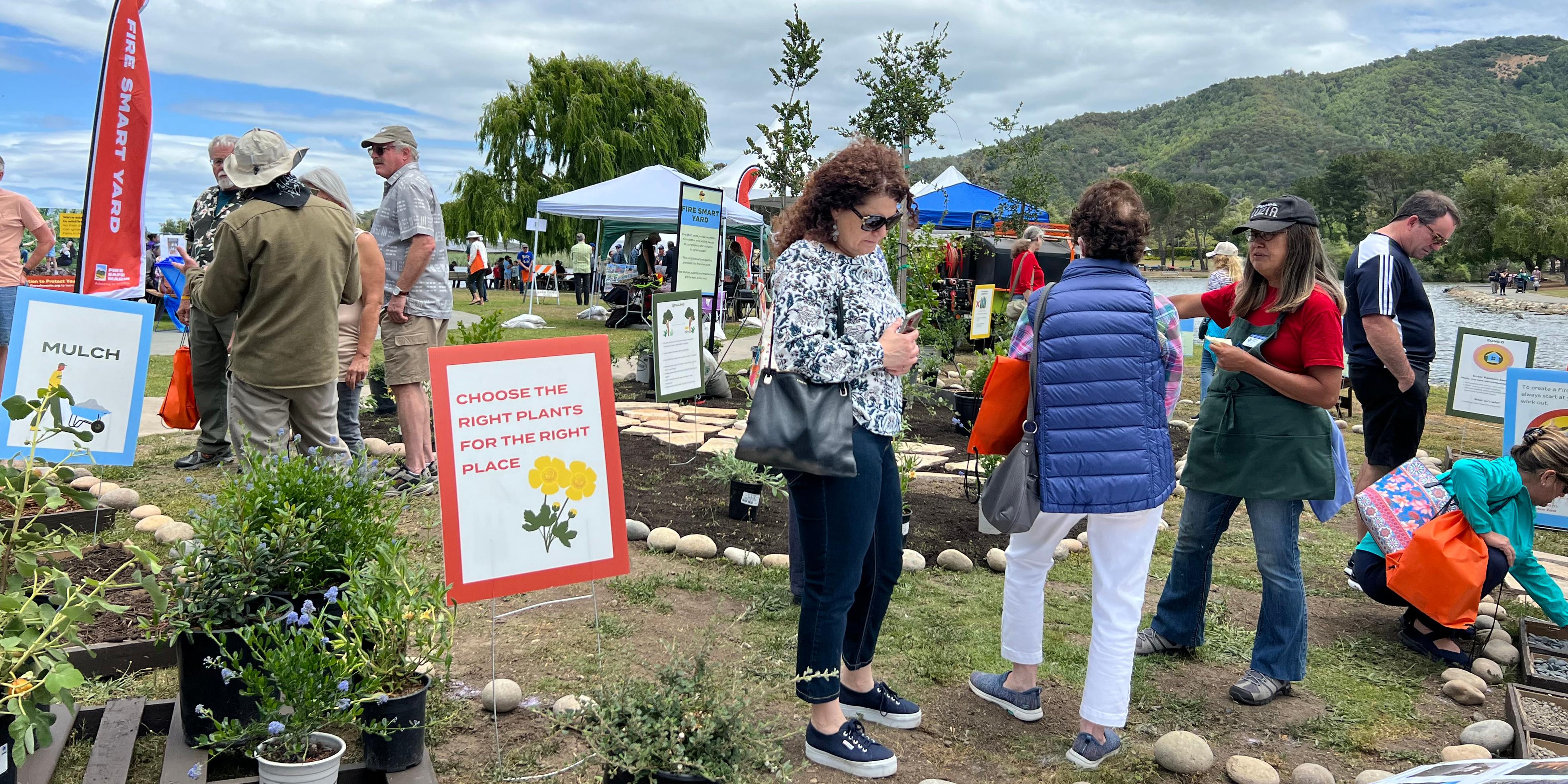 Visitors talk to UC Master Gardeners at a Fire Smart Demonstration Garden community event in Marin County. Photo/Bonnie Marks