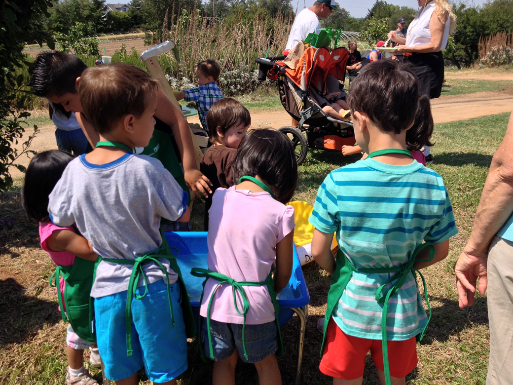 The vegetable-washing station was very popular on a warm day... as were the kid-sized Nutrition BEST aprons!