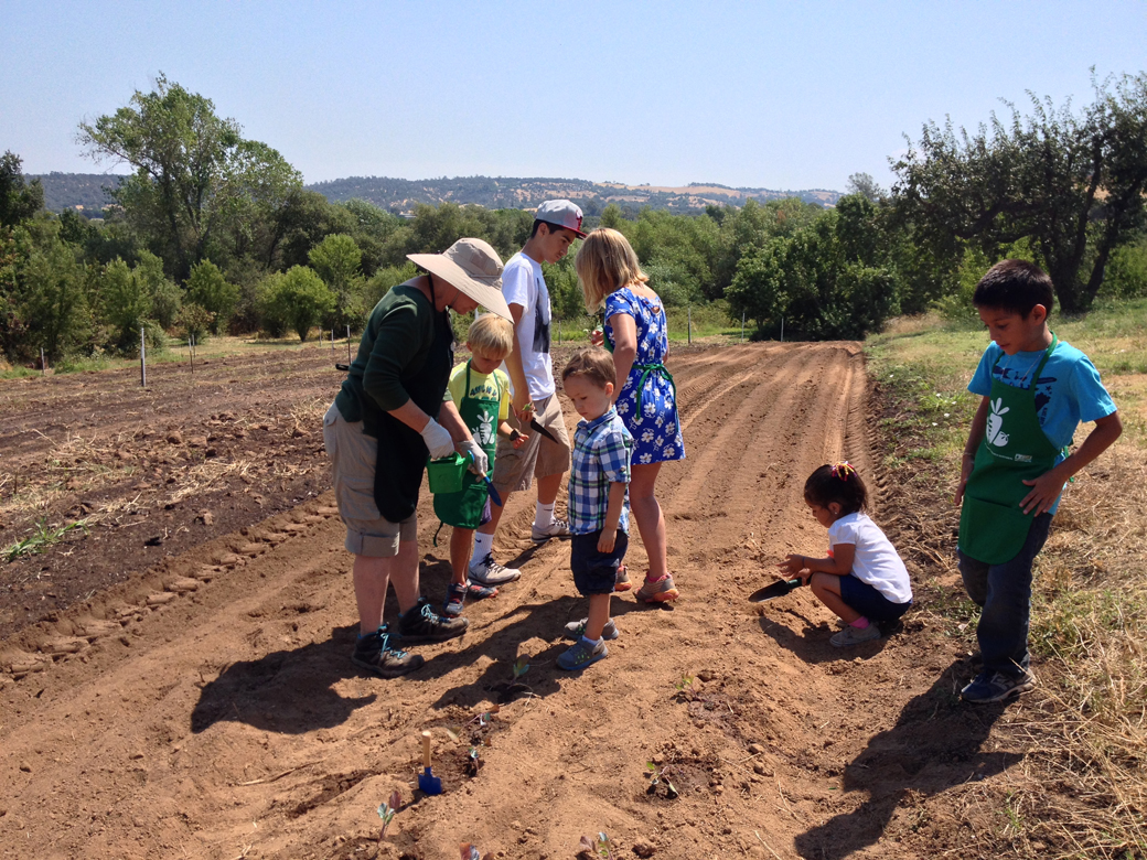 Master Gardeners Lynne and Teresa lead a vegetable planting lesson