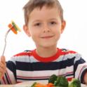 Boy eating vegetables