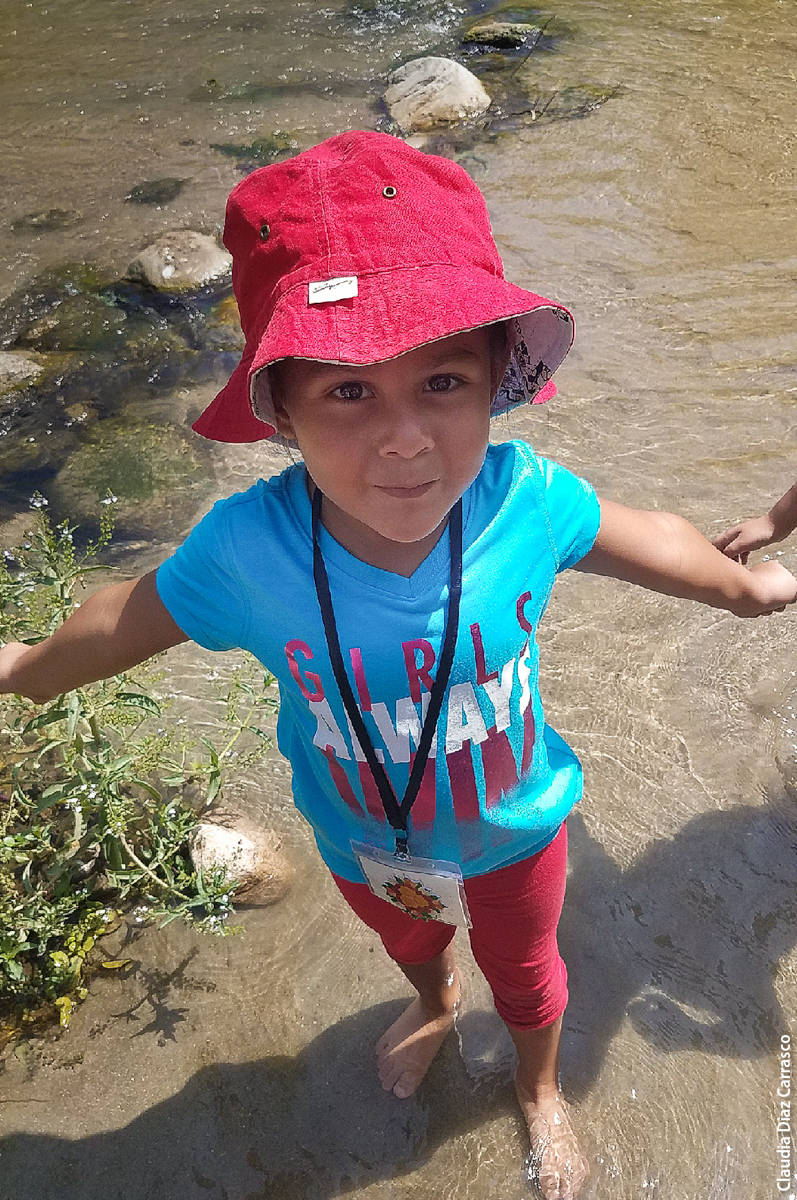 This is my first time touching the river. I love it! It's so cold!—Natalie (five years old)