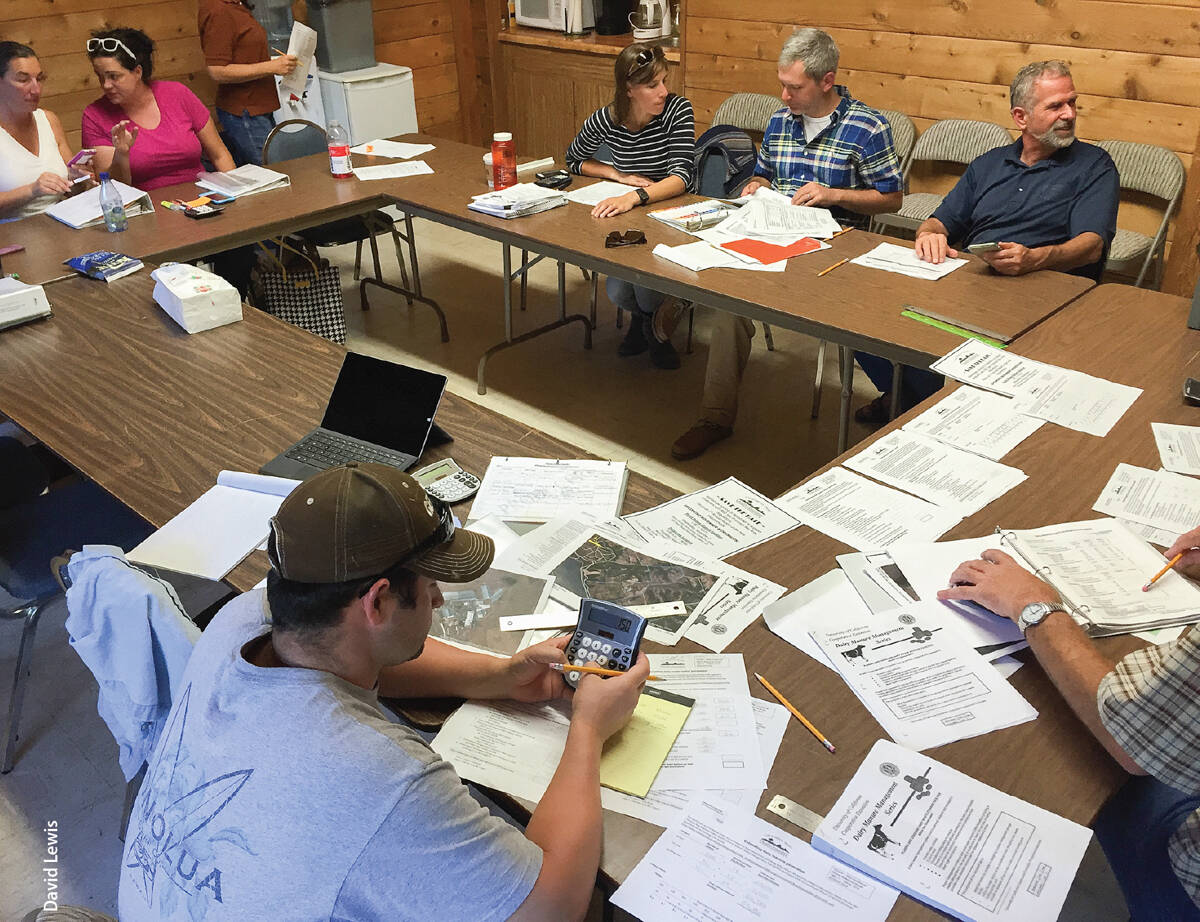 To help dairy operators estimate manure storage pond capacity needs, workshop leaders set up office hours where they provided one-on-one assistance with site-specific calculations.