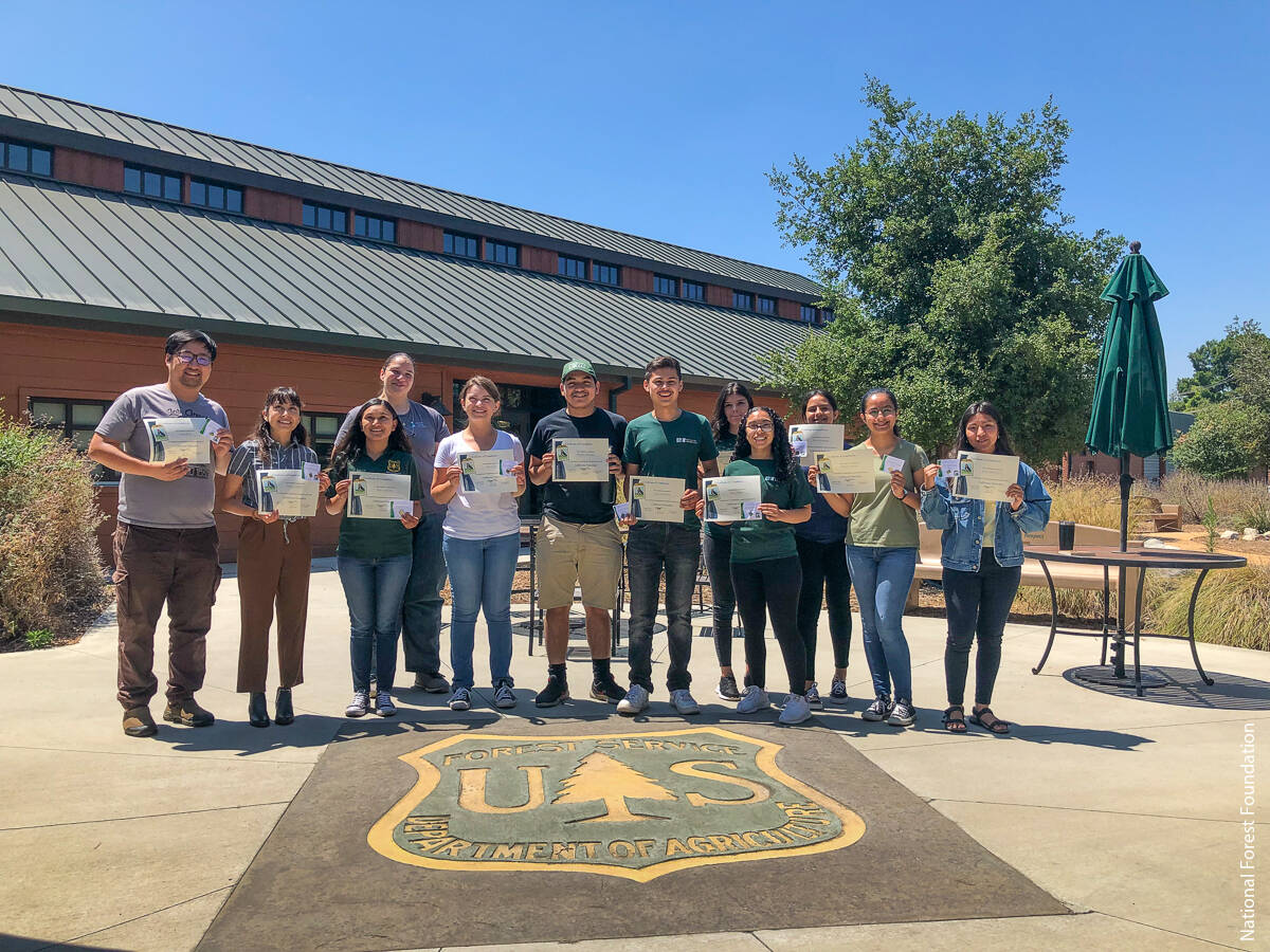 Students and instructor from the National Forest Foundation Angeles/San Gabriel Mountains course displaying their CalNat certificates.