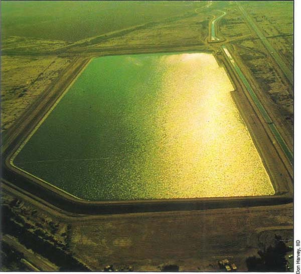Regulatory reservoirs such as the Carter Reservoir above are being constructed near the terminus of main canals. They conserve water by recovering and storing what would otherwise be lost as operational discharge into the drainage system.