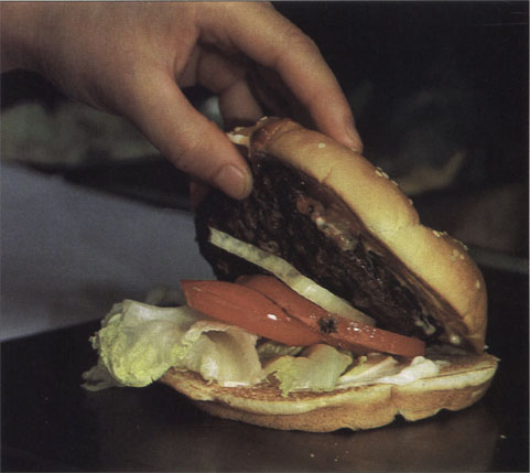 Undercooked hamburgers contaminated with E. Coli O157:H7 were responsible for a major outbreak of intestinal illness in 5 western states in 1993. Ground beef is unlike most other raw meats in that microbial contaminants are distributed throughout the product by grinding. Hamburger cooked rare or medium-rare can still contain viable organisms on the inside.