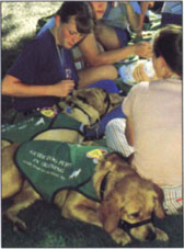 Lake County 4-H members Emily DeBolt, left, and Karl Pollock train guide dogs.