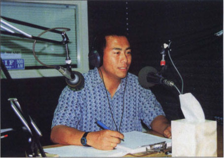 Michael Yang presents a 30-minute radio broadcast for Hmong farmers.