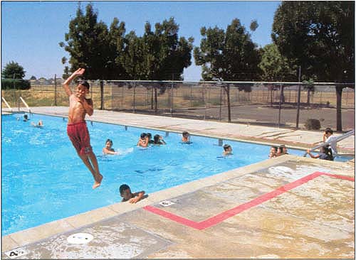 While many kids are “couch potatoes,” schools can play a role in encouraging healthier lifestyles. In Parlier, kids get some exercise at the city pool.