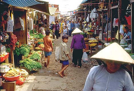 Global markets are critical to reap the full benefits of investments in agricultural research, including in biotechnology. Above, a produce market in Vietnam.