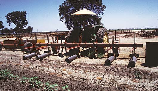 Furrow torpedoes are attached to a sled to ease turning at the end of the field.