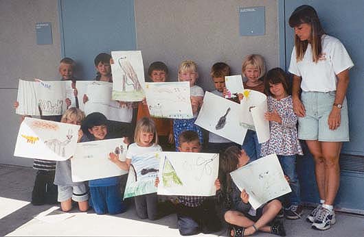 A program of the UC Davis Veterinary Medicine Extension, Animal Ambassadors seeks to stimulate interest in science through hands-on activities. Children from the San Luis Obispo County YMCA display their artwork from an Animal Ambassadors curriculum activity.