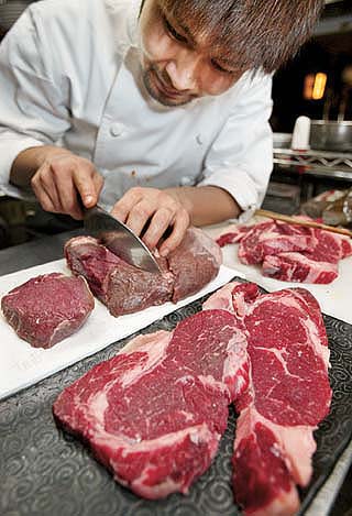 Japan, the world's top buyer of U.S. beef, suspended imports in late December 2003, after the U.S. confirmed its first case of mad cow disease. On Dec. 24, 2003, a Japanese chef sliced imported U.S. beef at a Tokyo restaurant.