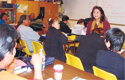 UCCE nutrition educator Lan Nguyen addresses a class at Fremont Adult School. In California two such programs, EFNEP and FSNEP, together evaluate the nutrition education received by 21,000 low-income families each year.