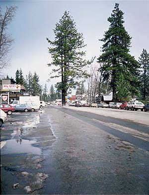 Runoff from, top, ski areas and urban roads such as in, above, Tahoe City, are important sources of sediments that are having an adverse impact on the storied clarity of Lake Tahoe.