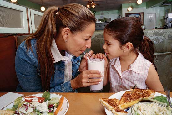 To better understand how mothers may influence their child's eating habits and weight, the authors studied pairs of low-income Latino mothers and their young children. This mother and daughter enjoying lunch were not study participants.