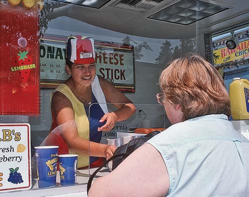 Fast foods are typically higher in calories and fat, while lacking essential nutrients. Current data indicates that eating out more often increases the risk of weight gain. Above, a food stand at the California State Fair in Sacramento.