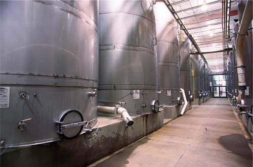 "New World” winemaking techniques — employed by countries such as the United States, Australia and Chile — emphasize consistency between vintages, economies of scale and modern technology (California winery shown). By contrast, “Old World” European winemaking is smaller scale and governed by complex rules.