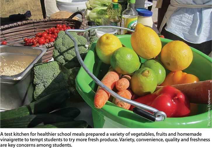 A test kitchen for healthier school meals prepared a variety of vegetables, fruits and homemade vinaigrette to tempt students to try more fresh produce. Variety, convenience, quality and freshness are key concerns among students.