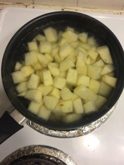 Boil potatoes until soft