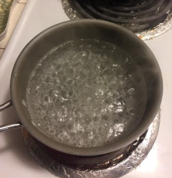 Boil 2 cups of water, then turn off heat.