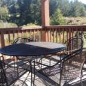 Small table & chairs on covered back deck