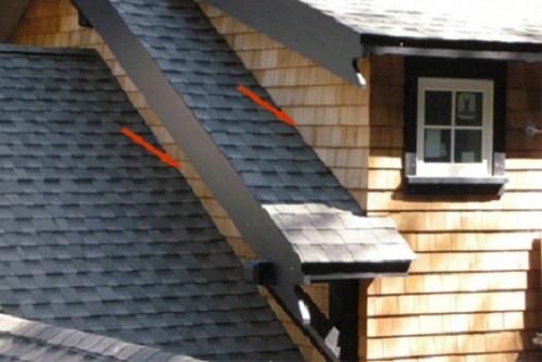 Complex roof design with wood shingle siding
