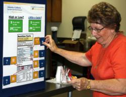 Participant from the Reedley Senior Center learns how to read a food label