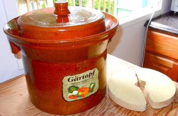 A sauerkraut crock with ceramic weights. Bdubay, CC BY-SA 3.0 <https://creativecommons.org/licenses/by-sa/3.0>, via Wikimedia Commons