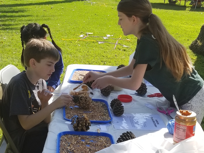 Samantha helped 4-H'ers made pine cone bird feeders