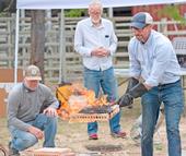 Ryan Tompkins, right, demonstrates wildfire risks. He will be posthumously honored by the state Board of Forestry on Nov. 6.