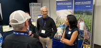 Michael Cahn, center, and Aparna Gazula explain how the decision-support tool CropManage helps farmers save water and fertilizer. for ANR Employee News Blog
