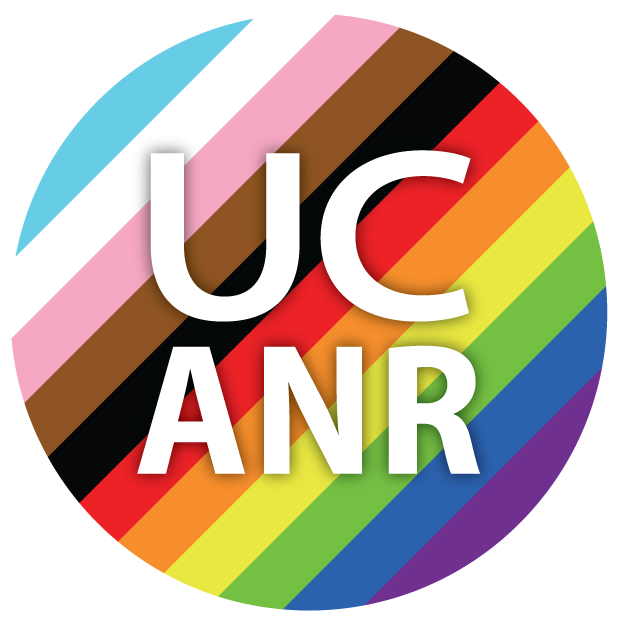 UC ANR in a circle with light blue, white, pink, brown, black, red, orange, yellow, green, royal blue and purple stripes.