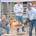 Ryan Tompkins, right, demonstrates wildfire risks. He will be posthumously honored by the state Board of Forestry on Nov. 6.