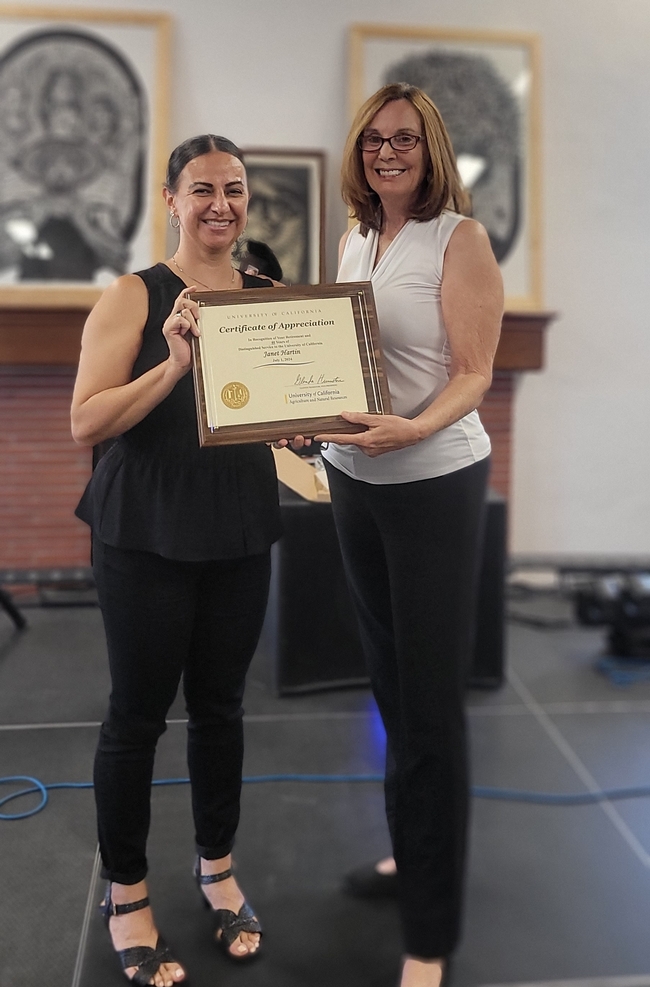 Hartin receives a certificate of appreciation from Rita Clemons, UCCE county director for Riverside, San Bernardino and Orange counties.