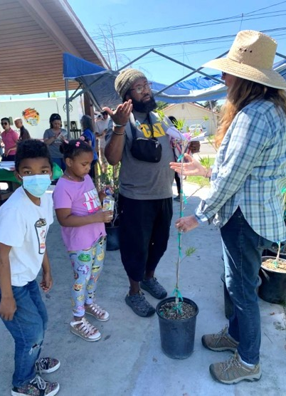 UC Master Gardener volunteers interact with community members during a TFTST event.