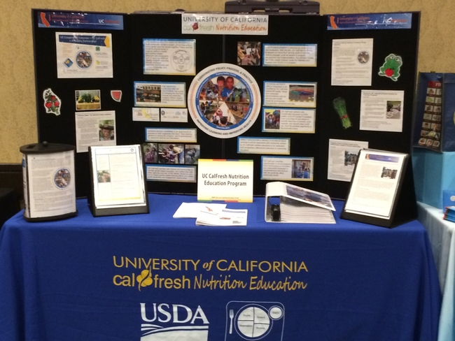 UC CalFresh displays UC Delivers “pay offs” with bulleted project highlights at a conference.