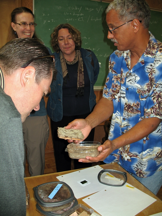 Lewis, right, describes his termite research to UC ANR colleagues Robin Meadows and Evett Kilmartin.