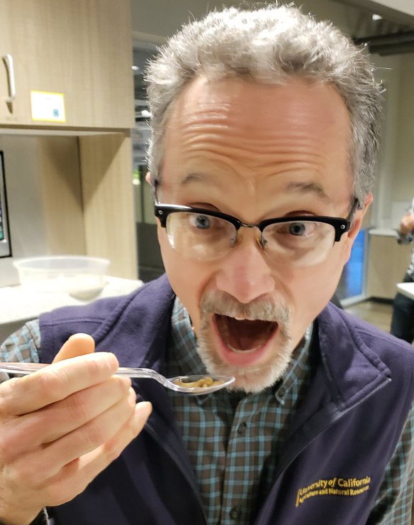 Jim Farrar eats meal worms, fulfilling his pledge to eat a pest if at least 20 people made a donation of $10 or more to UC IPM.