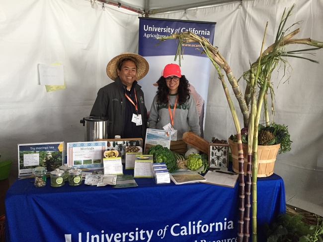 Michael Yang and Lorena Ramos, staff research and marketing associate for the UCCE small farms and specialty crops program in Fresno and Tulare counties, offered visitors hot moringa tea.