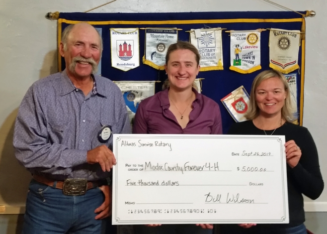 Bill Wilson, Alturas Sunrise Rotary president, with UCCE director Laura Snell, and Sadie Camacho, 4-H program representative.