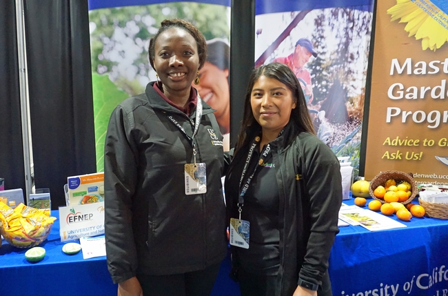 Nutrition, family and consumer sciences advisor Hawau Bojuwon, left, and community educator Beatriz-Rojas, both of Kern County, staff the ANR booth on the final day of the show.